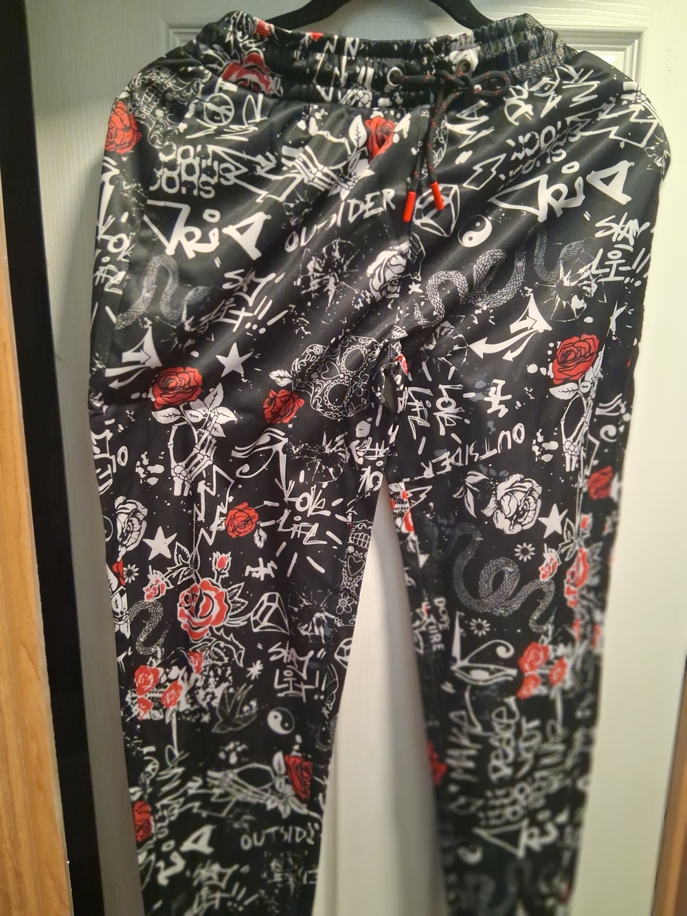 fresh Black Jogger Pants with Red and White Floral Graphics